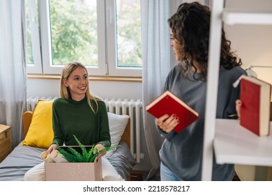 Female College Student Move In Dorm. They Are Talking In The Room