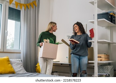 Female College Student Move In Dorm. They Are Talking In The Room