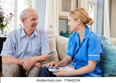 Female Community Nurse Visits Senior Man At Home