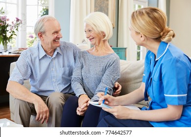 Female Community Nurse Visits Senior Couple At Home