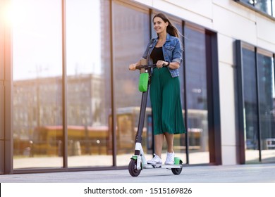 Female commuter riding electric push scooter 
 - Powered by Shutterstock