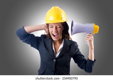 Female Construction Worker With Loudspeaker