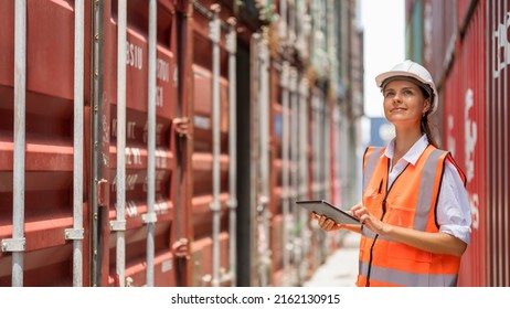 Female Container Yard Manager Using Tablet Working At Container Yard. Container Yard Warehouse, Cargo Shipping Import And Export Industry. Logistic Shipping Yard Business.