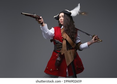 Female Corsair Aims Gun Holding Saber On Her Shoulder