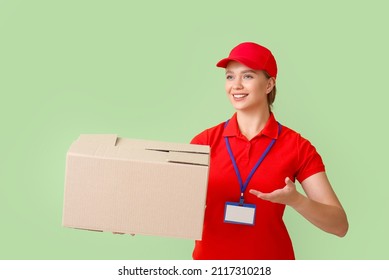 Female Courier With Parcel On Color Background