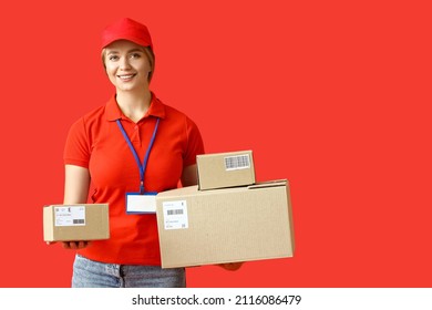 Female courier with parcels on color background