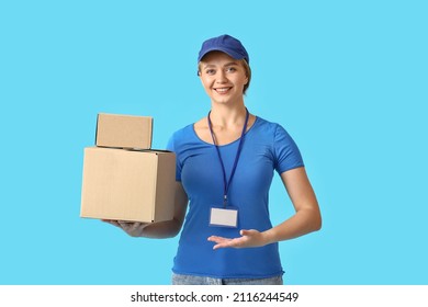 Female Courier With Parcels On Color Background