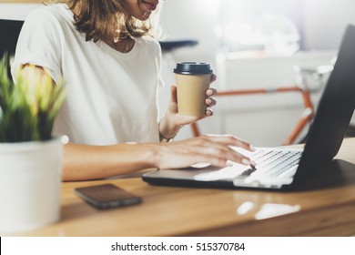Female Coworker Using Laptop While Sitting At Modern Workspace And Drinking Coffee To Go, Businesswoman Work Process Concept, Professional Young Manger Woman Working At Office Via Portable Computer