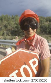 Female Crossing Guard With Stop Sign