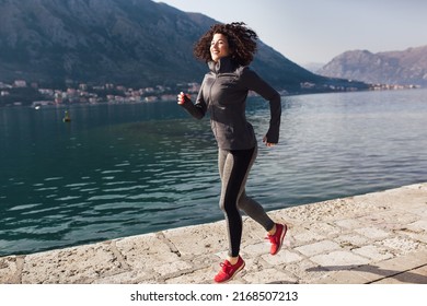 Female Curly Hair Runner Jogging During Stock Photo 2168507213 ...