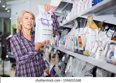 Female Customer Choose Pet Food In Zoo Store