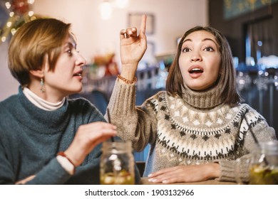 A Female Customer In A Restaurant Or Dining Room Gestures To The Waiter Or Receptionist To Complain Or Praise The Quality Of The Food