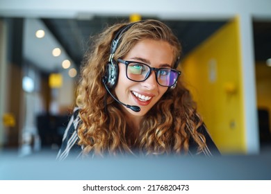 Female Customer Service Representative In A Headset Is Consulting Clients Online. Call Center And Business People Concept