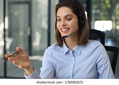 Female customer support operator with headset and smiling. - Shutterstock ID 1785002672