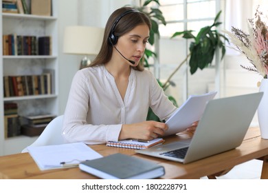 Female customer support operator with headset and smiling. - Shutterstock ID 1802228791