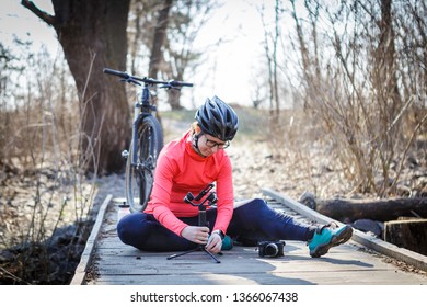 female cyclist blogger tunes steadicam - Powered by Shutterstock