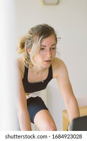 Female Cyclist During A Spin Class Workout