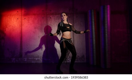 Female Dancer Is Dancing Alone In Dark Studio, Moving Her Body Sexually