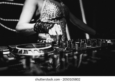 Female Deejay Playing Hits In A Party Of Electronic Music.
