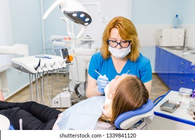 Female Dentist Blue Uniform Cure Tooth Stock Photo 1339841120 ...