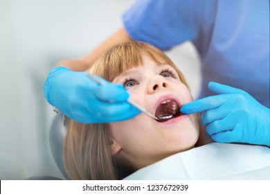 Female Dentist And Child In A Dentist Office