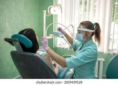 Female Dentist Hands Examines The Patient's Mouth, Dental Clinic