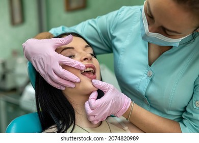 Female Dentist Hands Examines The Patient's Mouth, Dental Clinic