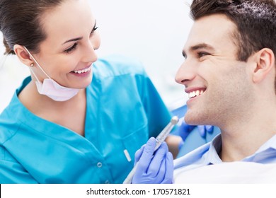 Female Dentist With Male Patient 