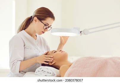 Female Dermatologist Make Skincare Procedures For Client In Modern Beauty Clinic. Caring Cosmetologist Do Face Lifting Treatment For Woman Patient In Aesthetic Medicine Salon. Cosmetology Concept.