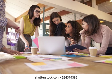 Female Designers Having Brainstorming Meeting In Office - Powered by Shutterstock