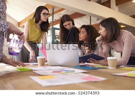 Female Designers Having Brainstorming Meeting In Office