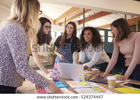 Female Designers Having Brainstorming Meeting In Office