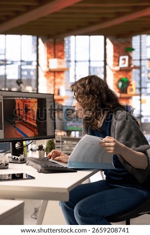 Female developer interacts with virtual AI assistant on PC to design a game hub, using automation and machine learning to generate futuristic space station designs for a sci fi video game.