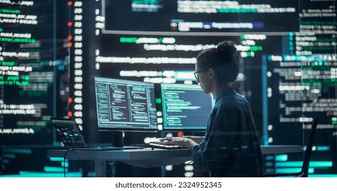 Female Developer Thinking and Typing on Computer, Surrounded by Big Screens Showing Coding Language. Professional Programmer Working in a Modern Office, Running Coding Tests. Futuristic Programming