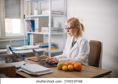 Female Dietitian Working In The Office