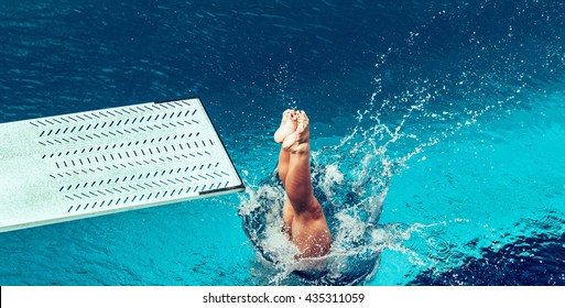 Female diver jumping from platform, high angle view