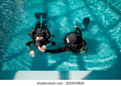 Female Diver And Male Instructor, Diving School