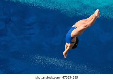 Female Diver On The Way To Water