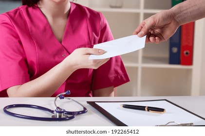 Female Doctor Accepting Bribery At Her Office