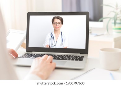 Female Doctor Advises Patient In Online Video Chat. Medical Consultation On Videoconference.