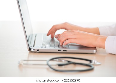 Female Doctor With Computer