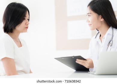 Female Doctor Consulting Patient. Asian People