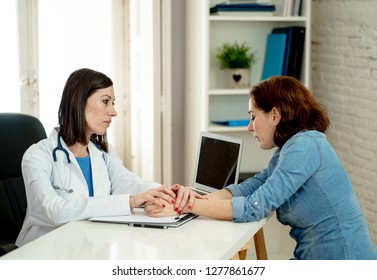 Female doctor discussing diagnosis with woman patient reassuring and comforting her with empathy in hospital office for Partnership Trust, Medical ethics, Bad news and Health care support concept. - Shutterstock ID 1277861677
