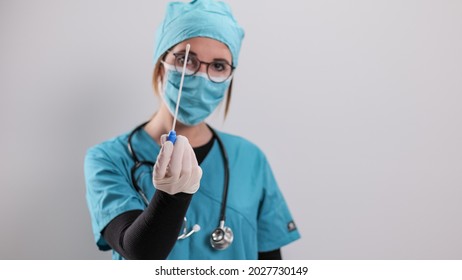 Female Doctor Examines A Blood Sample For The Corona Virus - Studio Photography