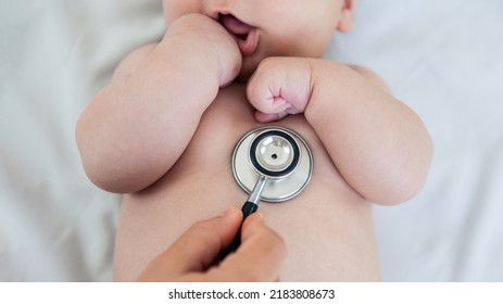 Female doctor examining baby boy toddler listening to lungs with stethoscope. A nurse having medical checkup with sick little newborn patient in clinic. Pediatrician's appointment, healthcare concept - Shutterstock ID 2183808673