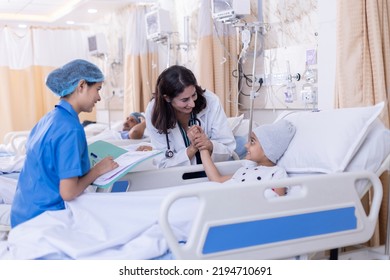 Female doctor examining little girl patient with nurse writing report at hospital
 - Powered by Shutterstock