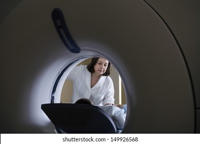 Female Doctor Examining Patient Before CT Scan