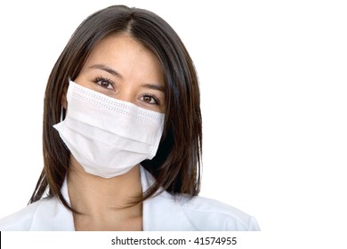 Female Doctor With Facemask Isolated Over A White Background