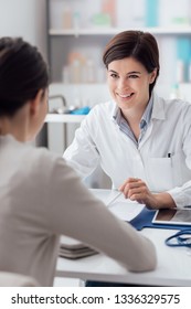 Female Doctor Giving A Consultation To A Patient And Explaining Medical Informations And Diagnosis