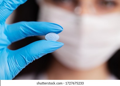 Female Doctor In Gloves Holds Pills For Men's Sexual Health